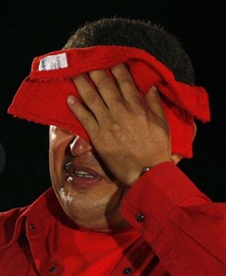 HugoChavezWipingFace